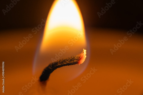 burning match on a dark background