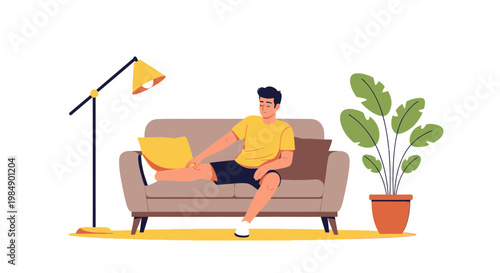 Man working on laptop on sofa at home, casual lifestyle, modern interior design