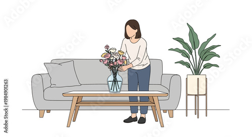 Woman arranging flowers in vase on coffee table in modern living room with sofa and plant