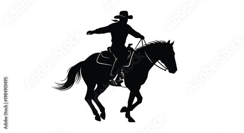 Silhouette of a cowboy riding a horse in a dynamic pose