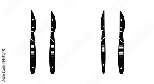 Four black pocket knives displayed in a striking silhouette