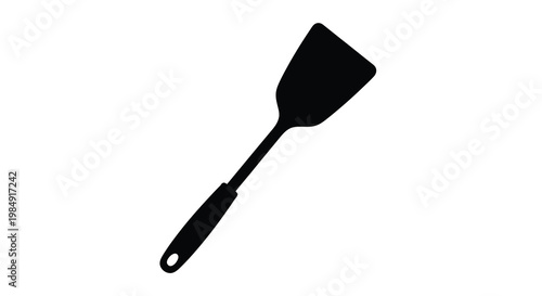 A black silhouette of a kitchen spatula on a white background
