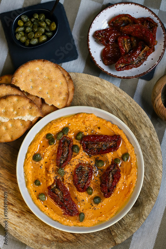 Hummus with sun-dried tomatoes and capers