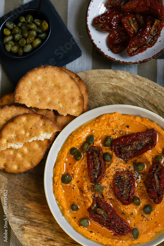 Hummus with sun-dried tomatoes and capers