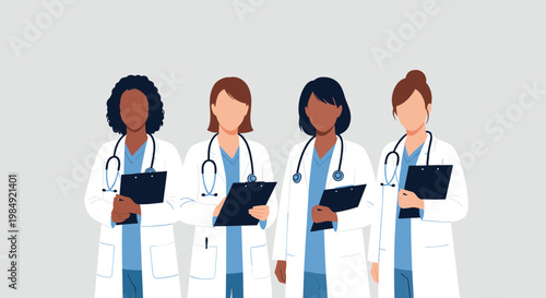Team of four professional female doctors or nurses from different ethnicities holding clipboards and wearing blue scrubs and coats.