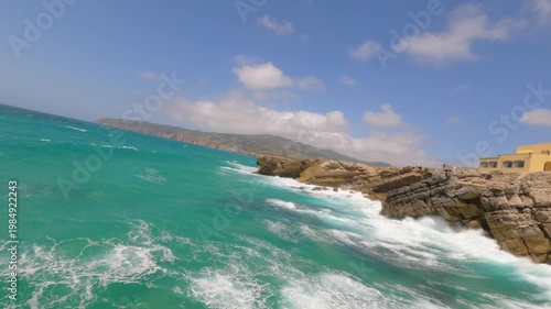 Aerial drone shot.View of famous beach in the summer, Crete, Greece. Famous beach with river and palm trees in Libyan sea. Tropical island, Panoramic view, Most beautiful beaches of Crete island