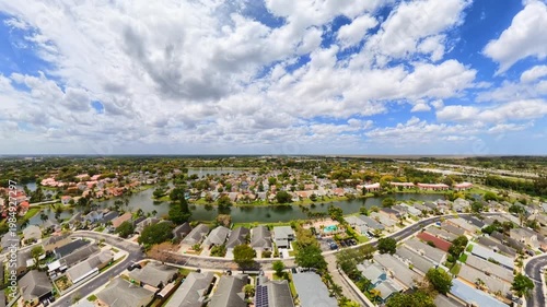 Ultra wide angle drone flyover neighborhood transition to view of earth