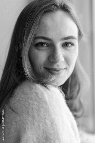 Portrait of young redhead woman with freckles in studio. Sensual expressive happy woman