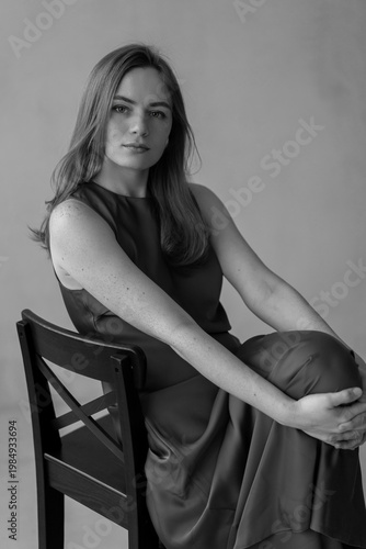 Portrait of young redhead woman with freckles in studio. Sensual expressive happy woman