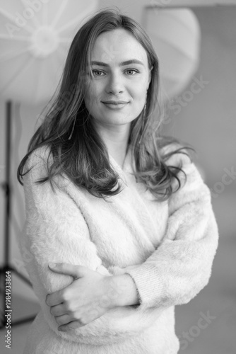 Portrait of young redhead woman with freckles in studio. Sensual expressive happy woman