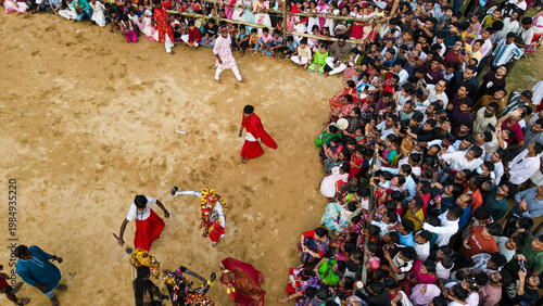 Fotografía Aerial view of large crowd celebrating traditional Charak Puja festival at Lakkatura tea garden in Sylhet, Bangladesh