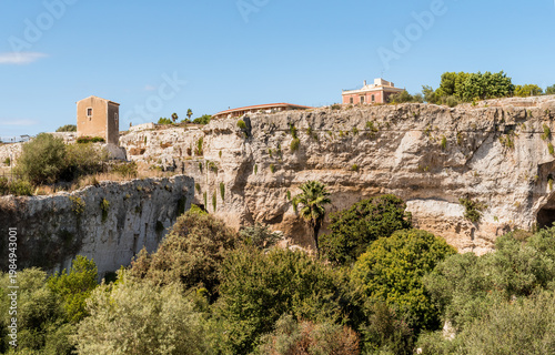 Wallpaper Mural The Latomia del Paradiso inside the Neapolis Archaeological Park in Syracuse, Sicily, Italy. Historic archaeological site connected to Greek and Roman history. Torontodigital.ca