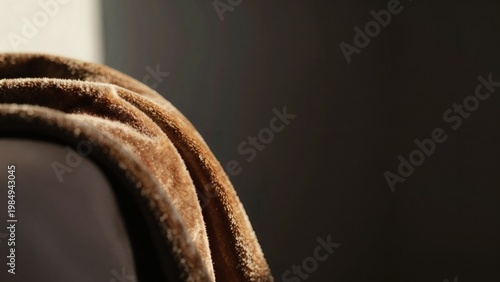 Soft Amber Velvet Fabric Folds with Warm Window Light and Dark Moody Copy Space Background Banner