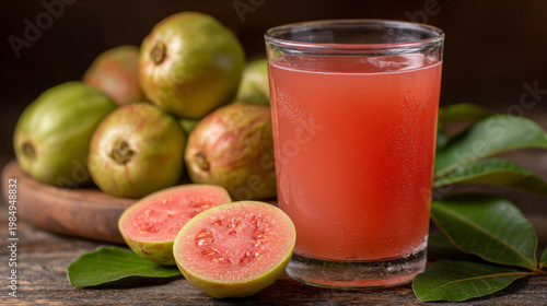 Refreshing glass of guava juice with fresh guava slices arranged around it