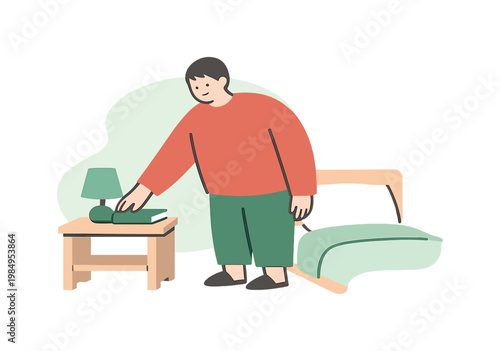 Person reaching for a book on a bedside table with a lamp