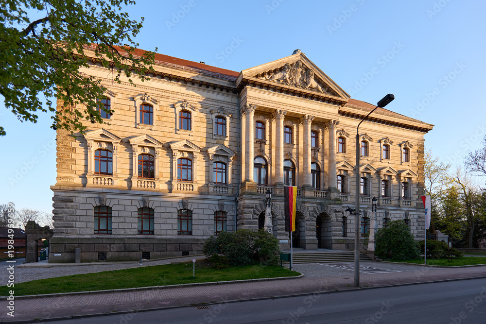 Naklejka premium Altenburg / Germany: District office building in a former ducal ministerial building from the late 19th century in the evening sun
