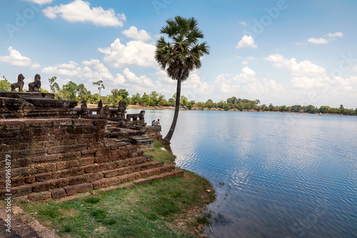 Travel Couple Relaxing at Srah Srang Angkor Cambodia Nature Landscape