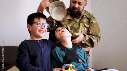 Happy father and sons including child with disability having fun hugging at home - Family love and support concept