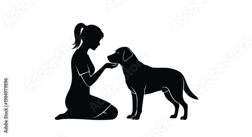 Silhouette of a woman kneeling and offering a treat to a friendly dog in a peaceful outdoor setting
