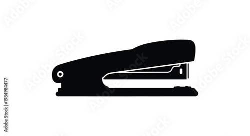 A black silhouette of a common office stapler simple and graphic silhouette