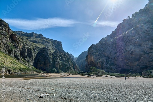 Wild mountain landscape at the famous Mediterranean gorge featuring massive rock formations and a dry riverbed. Iconic natural landmark for European tourism advertising and trekking campaigns.