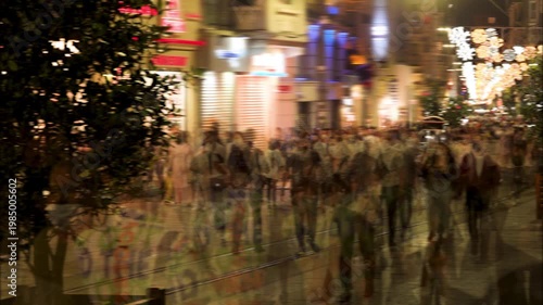 time lapse of people walking in the city at night. crowded unrecognizable pedestrians in the street.