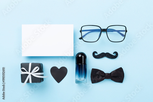 Happy Father's Day accessories on color background, top view