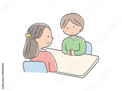 対面で話し合う子供と女性カウンセラー