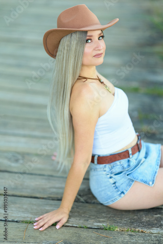 Woman sitting outdoors by water
