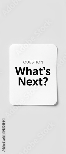 A question card with the text 'What's Next?' set against a blurred background.