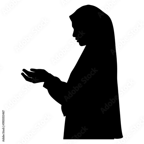 Silhouette of a Muslim Woman in Prayer.