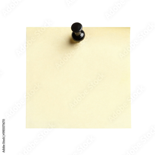Yellow sticky note with black push pin on white background is displayed