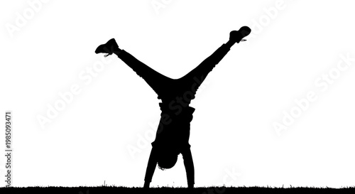 A silhouette of a person doing a handstand on a grassy field with a white background