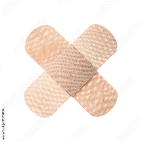 Two bandages crossed over light brown surface isolated on a transparent background