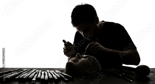 A makeup artist applies makeup to a woman's face in a dark room with various makeup brushes scattered around.