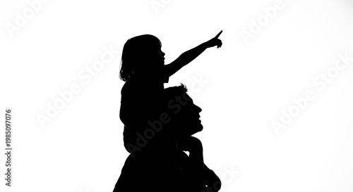 A silhouette of a man carrying a child on his shoulders with the child pointing upwards.