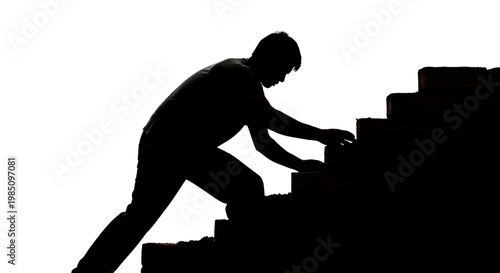 A silhouette of a man climbing a staircase, symbolizing progress and determination