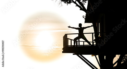 A serene silhouette of a man practicing yoga on a balcony at sunset