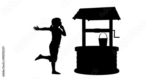A silhouette of a child making a wish at a traditional well with a bucket and roof