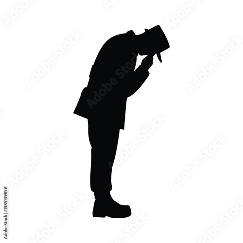 Silhouette of a soldier bowing head in solemn military tribute with military, silhouette