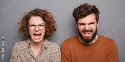 Couple with angry woman and happy man