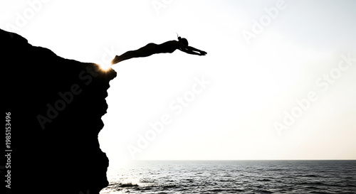 A person jumping off a cliff into the ocean at sunset