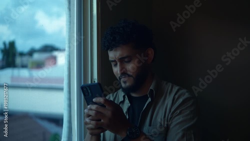 Stressed worried man receiving bad news on smartphone