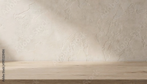 empty wooden table against beige textured wall with sunlight