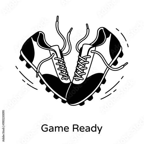 Pair of black and white soccer cleats ready for game