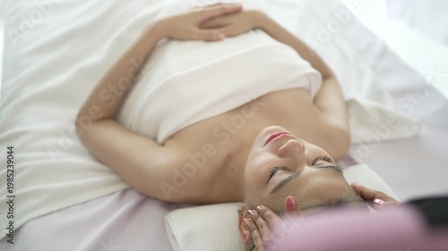 The pretty woman is relaxing at hotel 's massage  and spa. Lifestyle, leisure activity.