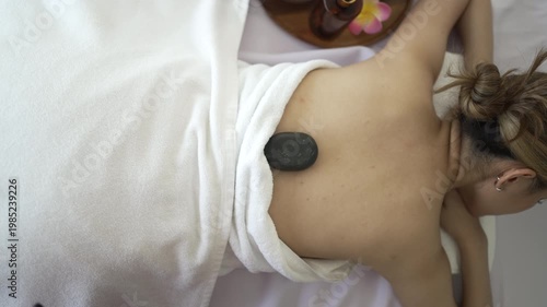 The pretty woman is relaxing at hotel 's massage  and spa. Lifestyle, leisure activity.