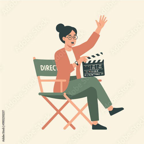 Woman Director Sitting on Chair Holding Clapperboard.