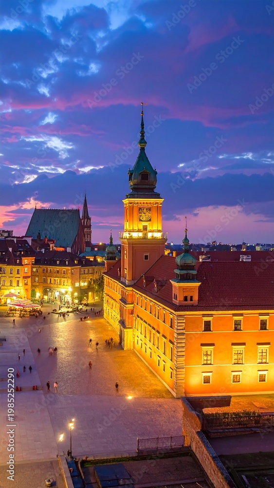 Fototapeta premium A serene city square at dusk with illuminated buildings and a clock tower