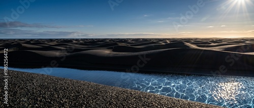Abstract Black Volcanic Sand Dunes with High Contrast Side Lighting and Copy Space
